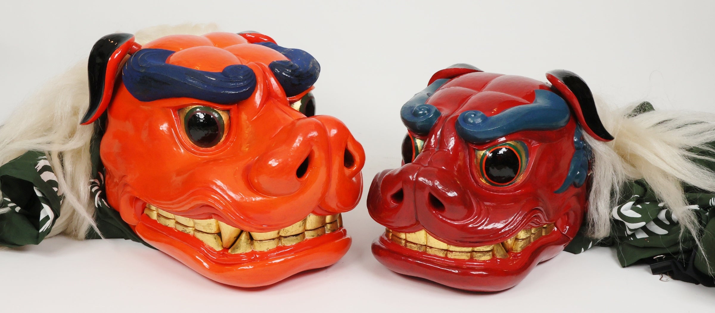 This lion dance head is completely handmade by a skilled woodworker, carved from real wood and colored with special paint.